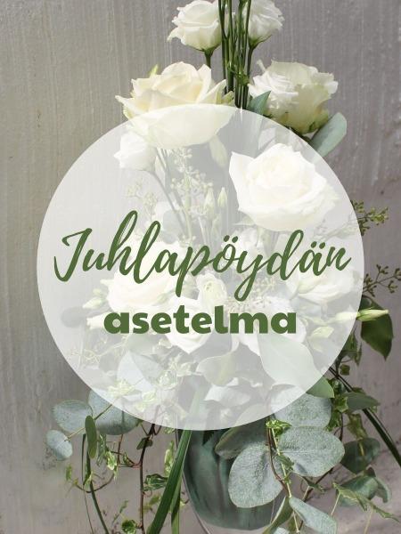 Juhlapöydän asetelma